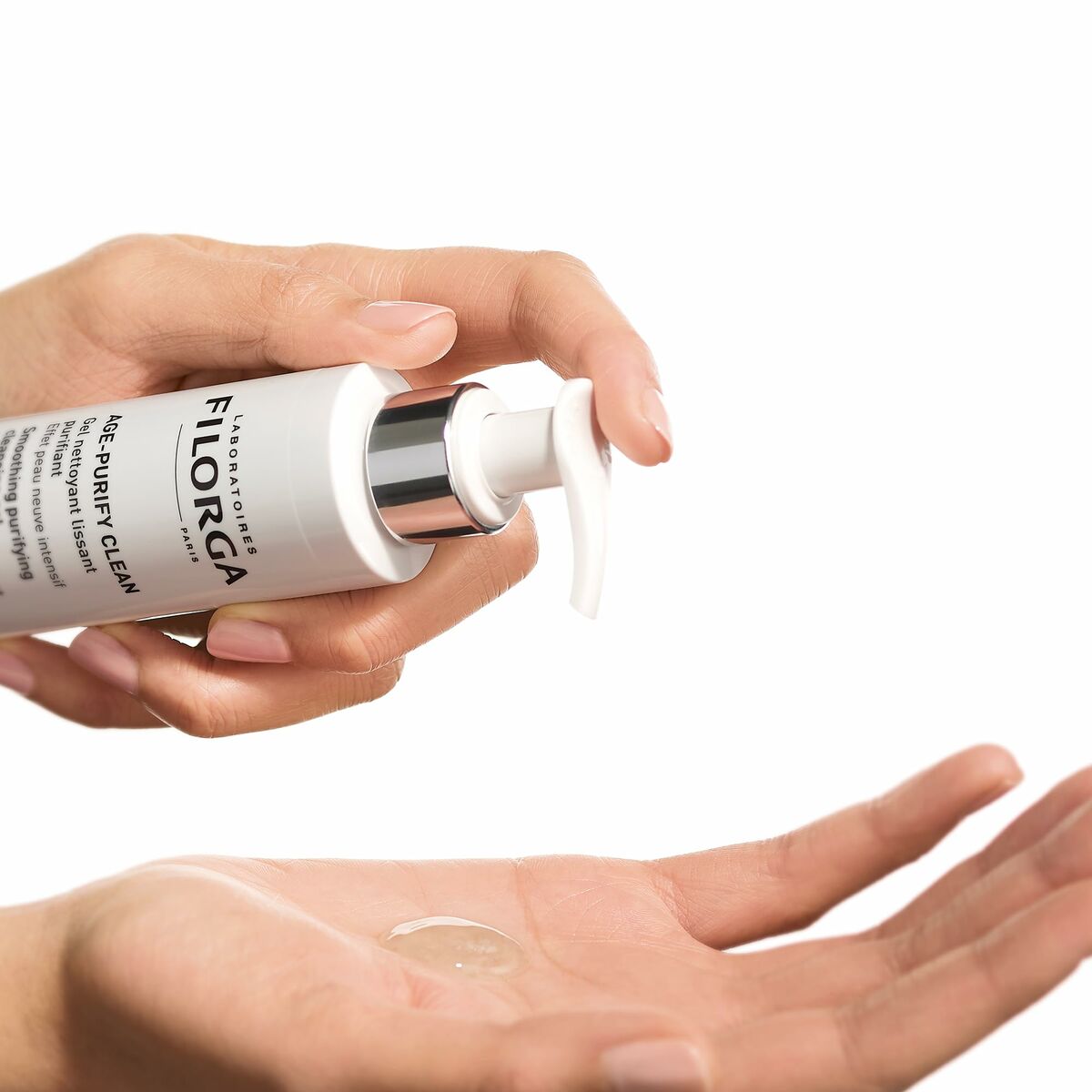 Filorga facial cleansing gel being dispensed into a hand, showcasing quality skincare for beauty enthusiasts.
