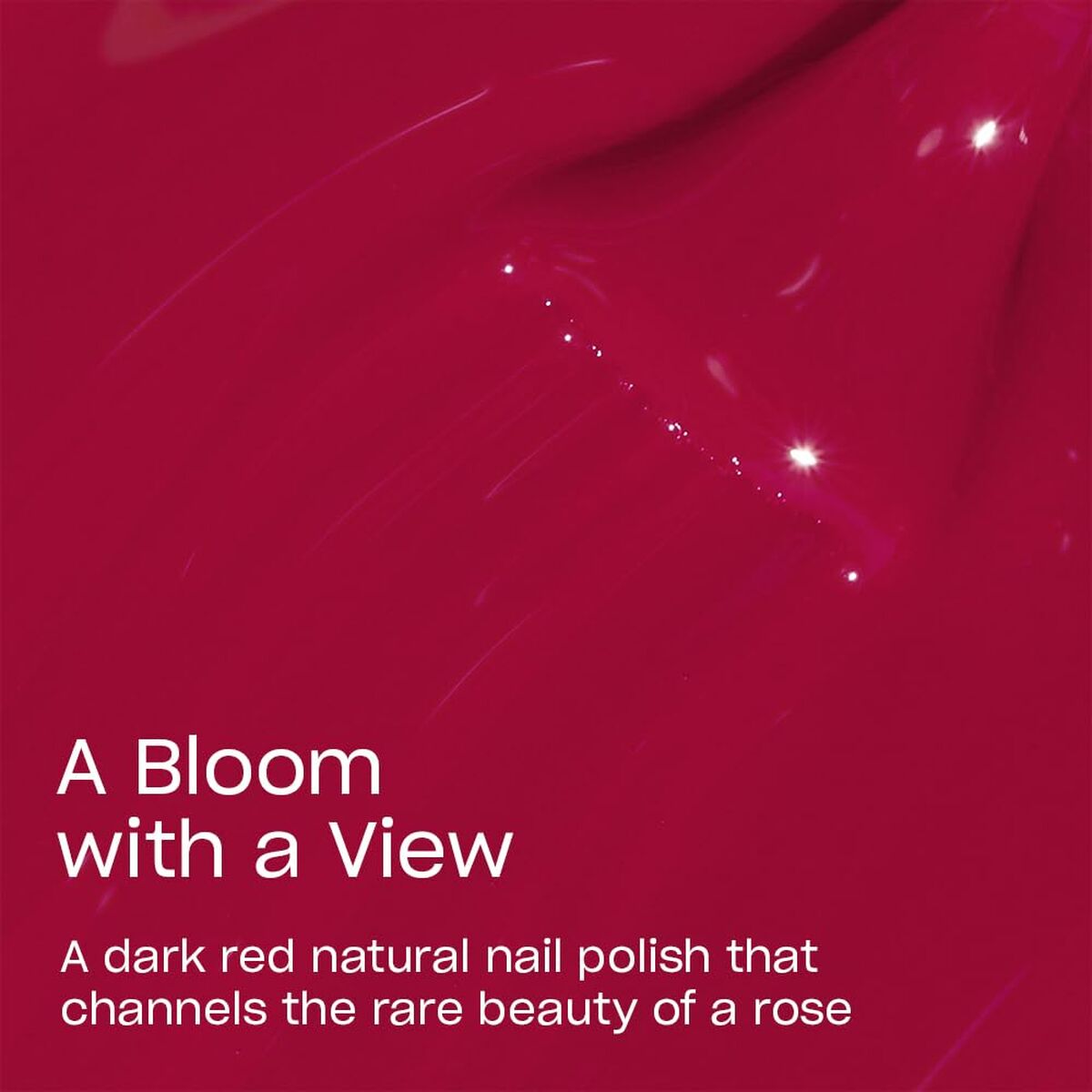 Dark red natural nail polish called A Bloom With A View, inspired by the beauty of a rose.