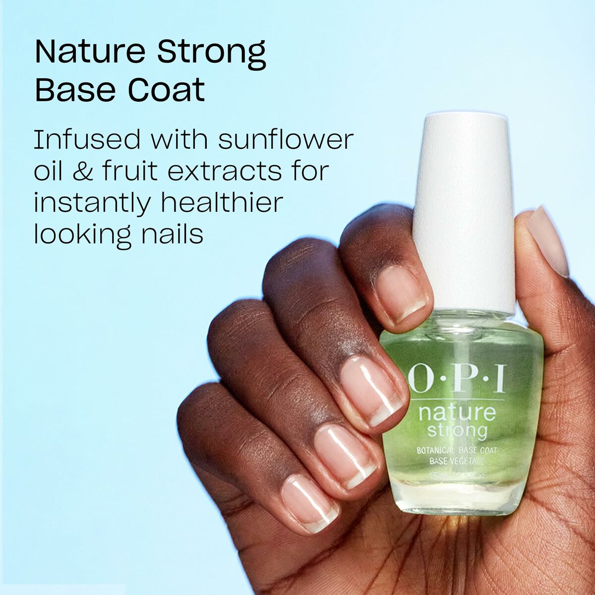 Nature Strong Base Coat from OPI, featuring a hand holding the bottle with a natural finish for healthier nails.